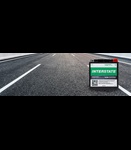 Interstate factory-activated AGM powersports battery on open paved highway with lane markings stretching into the distance