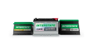 Three Interstate automotive batteries displayed together